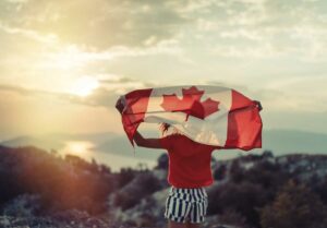 Canadian Based Companies - Woman Holding Canada Flag